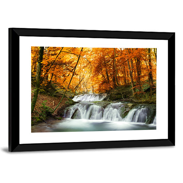 Waterfall In Autumn Forest Thailand Canvas Wall Art in brown, orange and yellow, framed print, product view on a white background