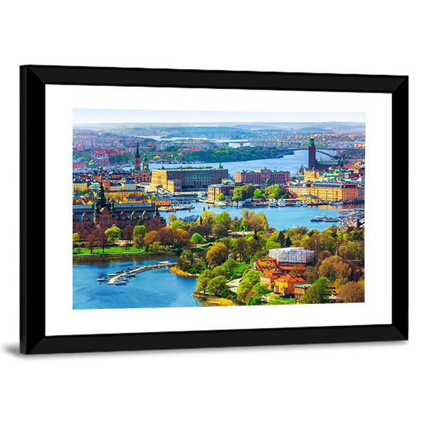 Old Town Gamla Stan In Stockholm Canvas Wall Art in orange, green and blue, framed print shown in a room