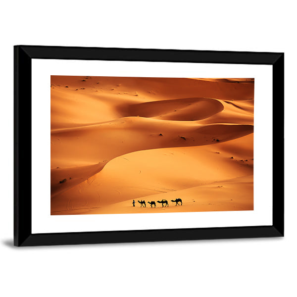 Camel Caravan Across Sahara Sand Dunes Canvas Wall Art in brown, orange and yellow, framed print, product view on a white background