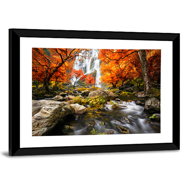 Autumn Waterfall In Kanchanaburi Thailand Canvas Wall Art in brown, orange and green, framed print, product view on a white background