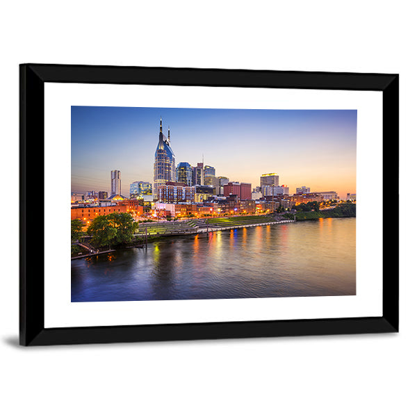 Nashville Skyline on the Cumberland River Canvas Wall Art in orange, yellow and blue, framed print, product view on a white background