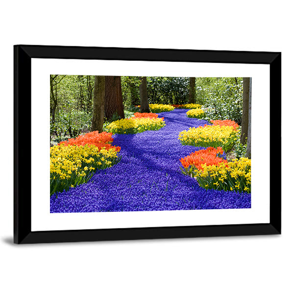 Field Of Spring Flowers Canvas Wall Art in yellow, green and blue, framed print, product view on a white background