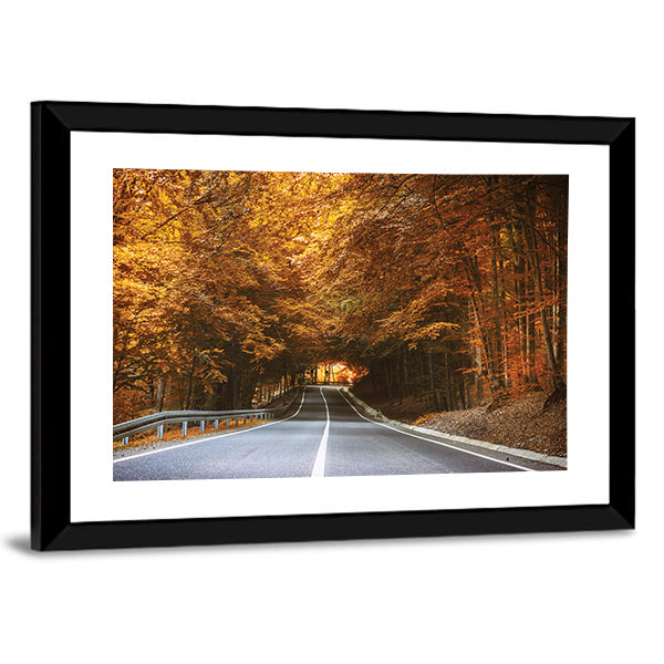 Forest Road in Autumn Canvas Wall Art in brown, orange and yellow, framed print, product view on a white background
