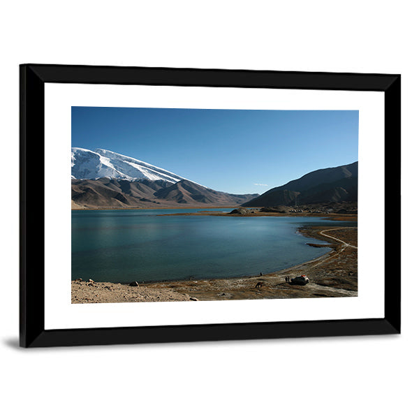 Mountain Muztahgata And Kara Kul Lake In Xinjiang China Canvas Wall Art in white, brown and blue, framed print, product view on a white background