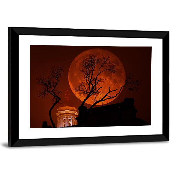 Blood Red Supermoon Over Illuminated Dome Canvas Wall Art in black, red and orange, framed print, product view on a white background