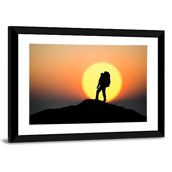Silhouette Of Rock Climber On The Peak Canvas Wall Art in black, orange and yellow, framed print, product view on a white background