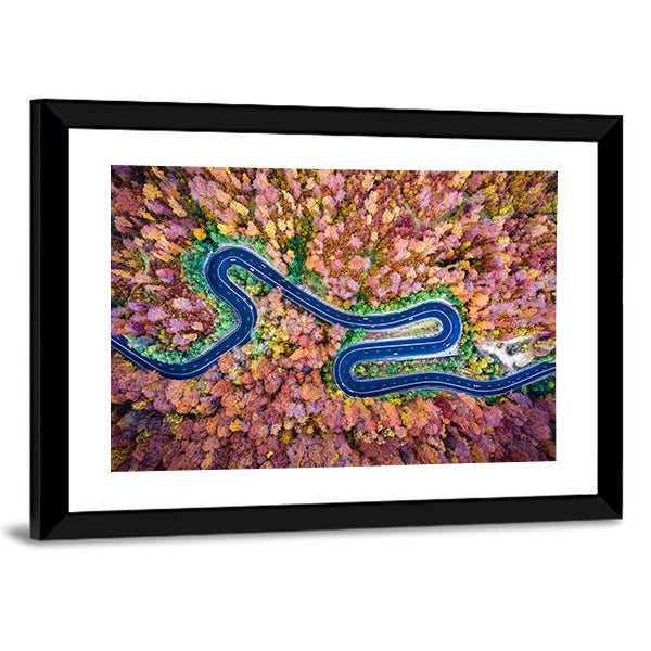 Curved Winding Road Through The Forest Canvas Wall Art in yellow, blue and pink, framed print, product view on a white background