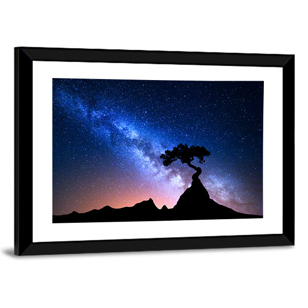 Alone Tree Under Starry Sky Canvas Wall Art in black, blue and purple, framed print, product view on a white background