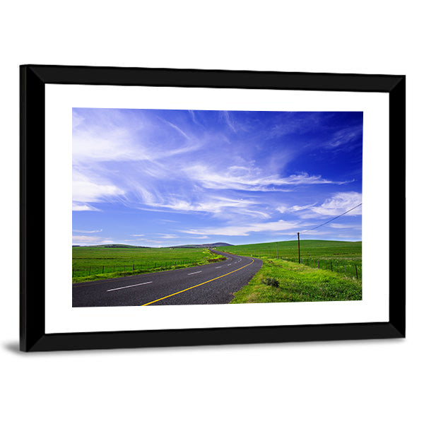 Winding Road Through Green Fields Canvas Wall Art