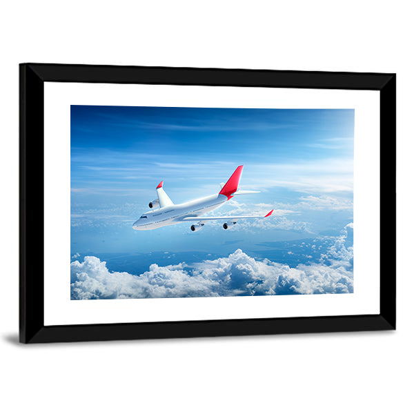 Airplane Flying Above Clouds Canvas Wall Art
