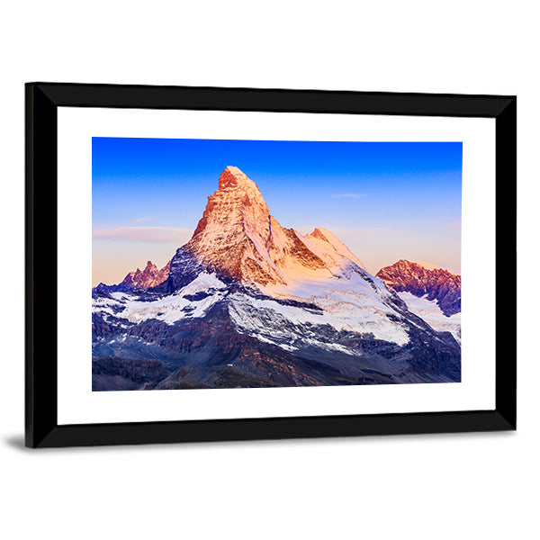 Matterhorn At Sunrise Canvas Wall Art in white, orange and blue, framed print, product view on a white background