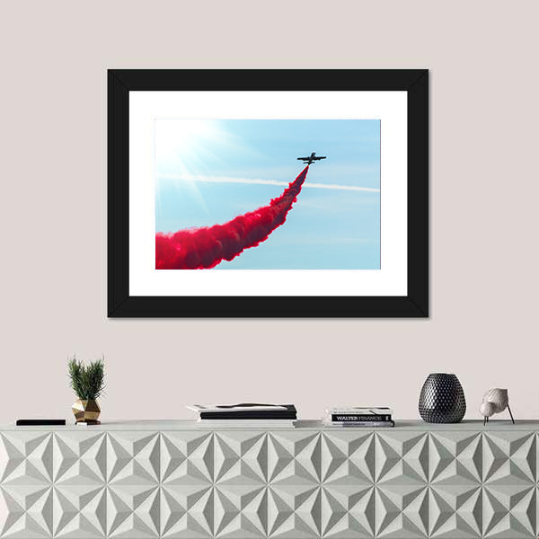 Airplane fly With Red Trail Smoke Canvas Wall Art