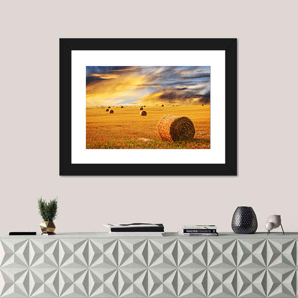 Golden Sunset Over Farm Field With Hay Bales Canvas Wall Art