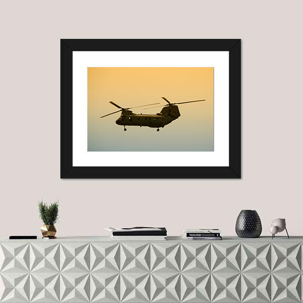 Military Cargo Helicopter In Flight At Dawn Canvas Wall Art