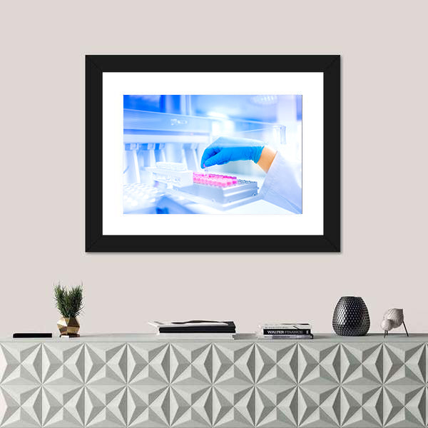 Hand Holding Vial in Medical Laboratory Canvas Wall Art