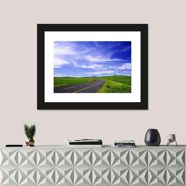 Winding Road Through Green Fields Canvas Wall Art