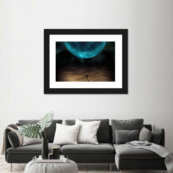 Silhouetted Figure Beneath Giant Blue Planet Canvas Wall Art