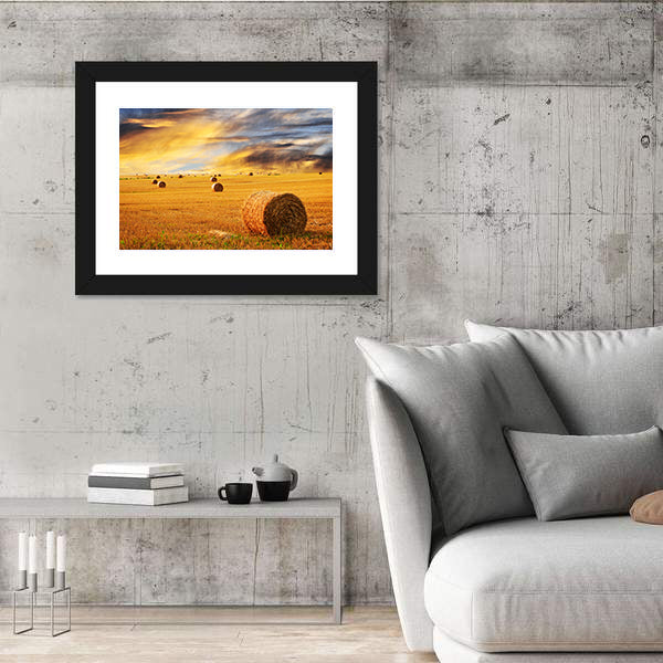 Golden Sunset Over Farm Field With Hay Bales Canvas Wall Art
