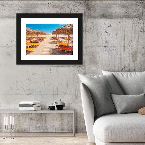 Greek Beach with Wooden Walkway and Orange Loungers Canvas Wall Art