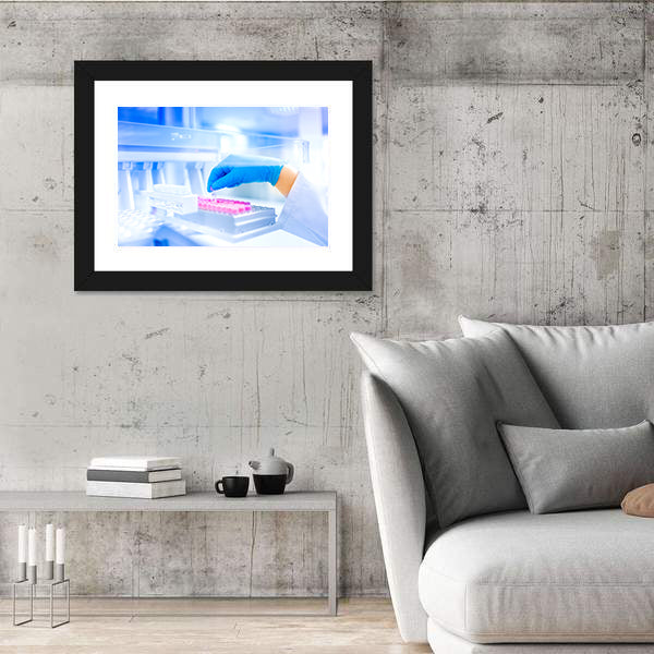 Hand Holding Vial in Medical Laboratory Canvas Wall Art