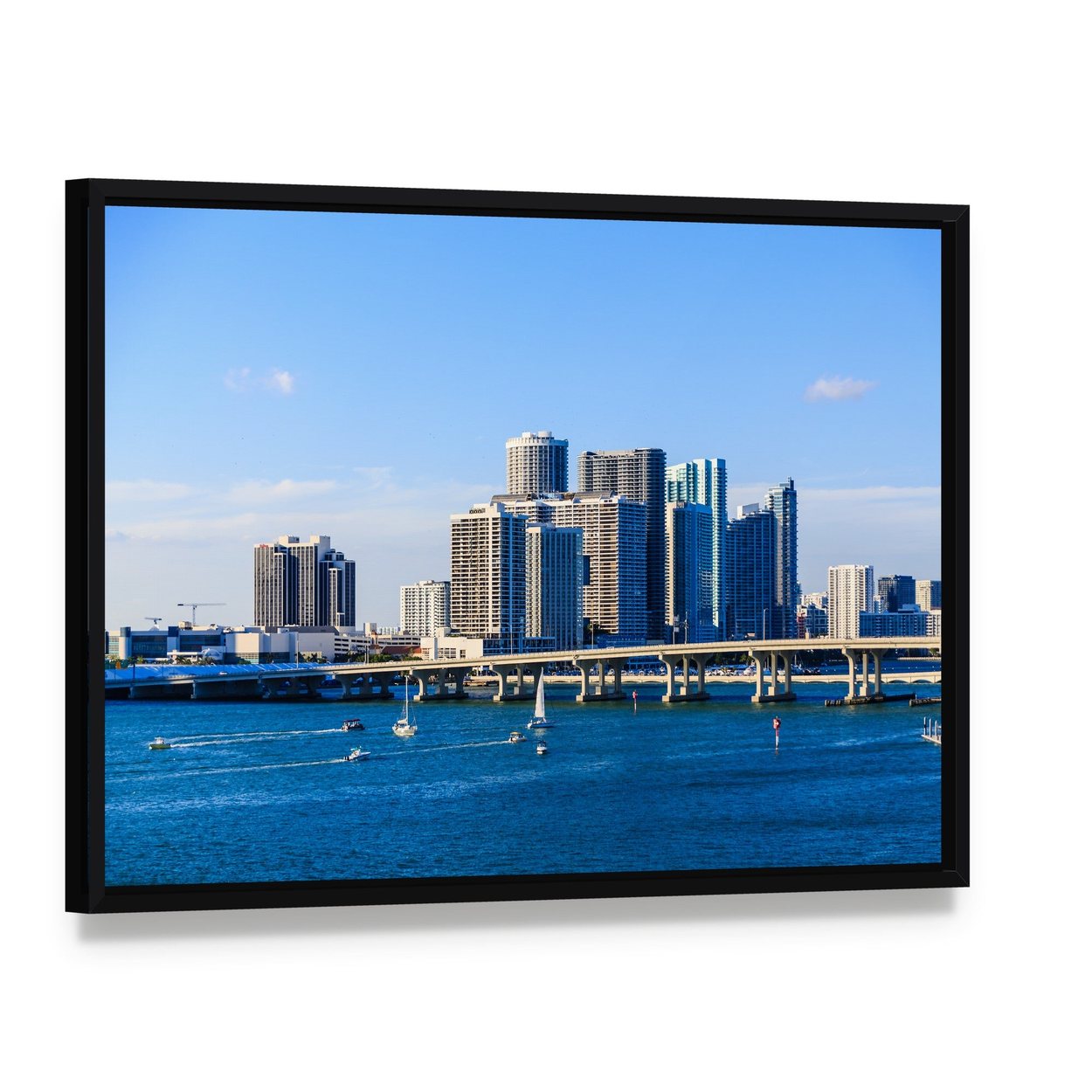 Miami Skyline Causeway View Canvas Wall Art, framed canvas in a black floater frame, angled product view