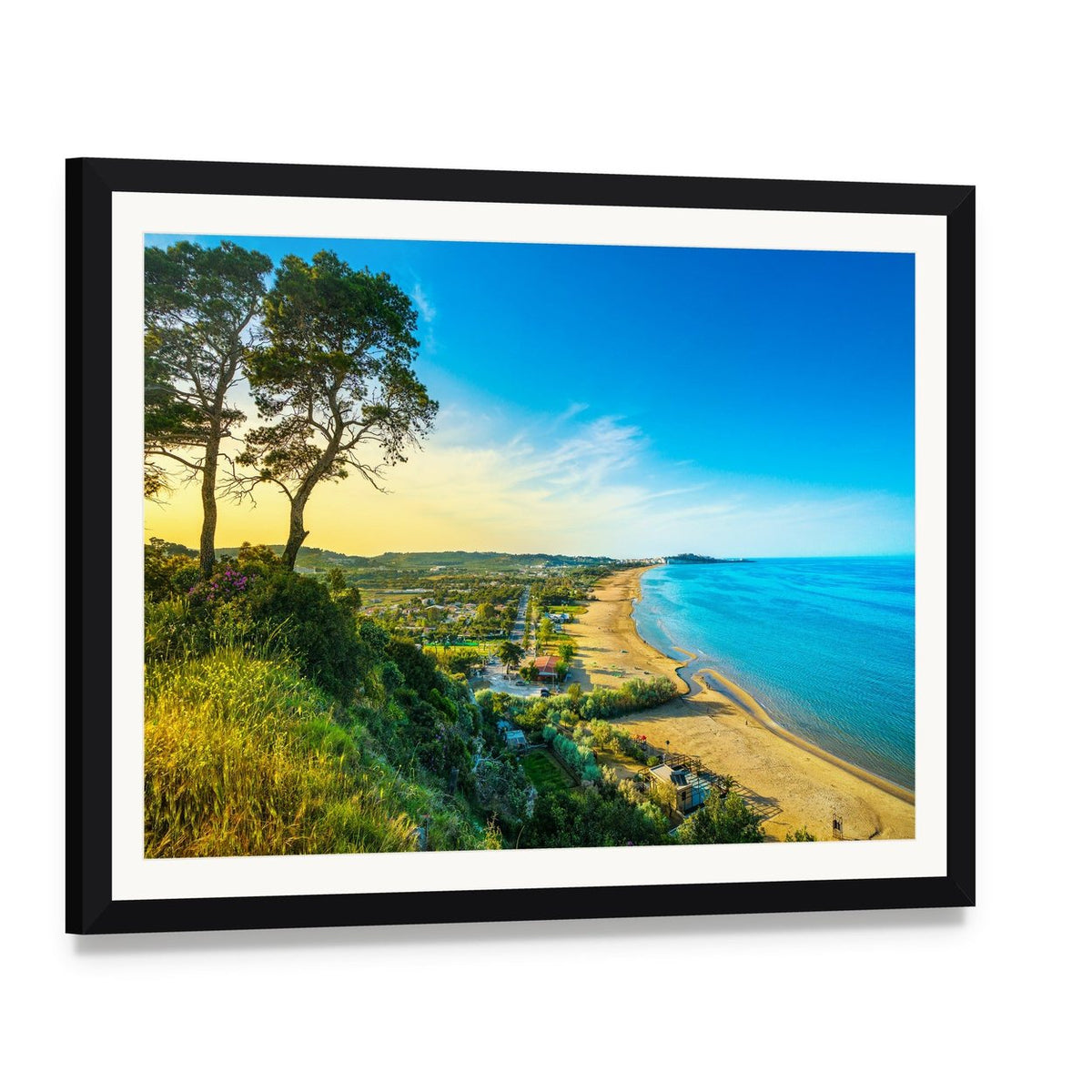 Clifftop Beach with Two Trees at Sunset Canvas Wall Art, framed print with white mat and black frame, angled product view