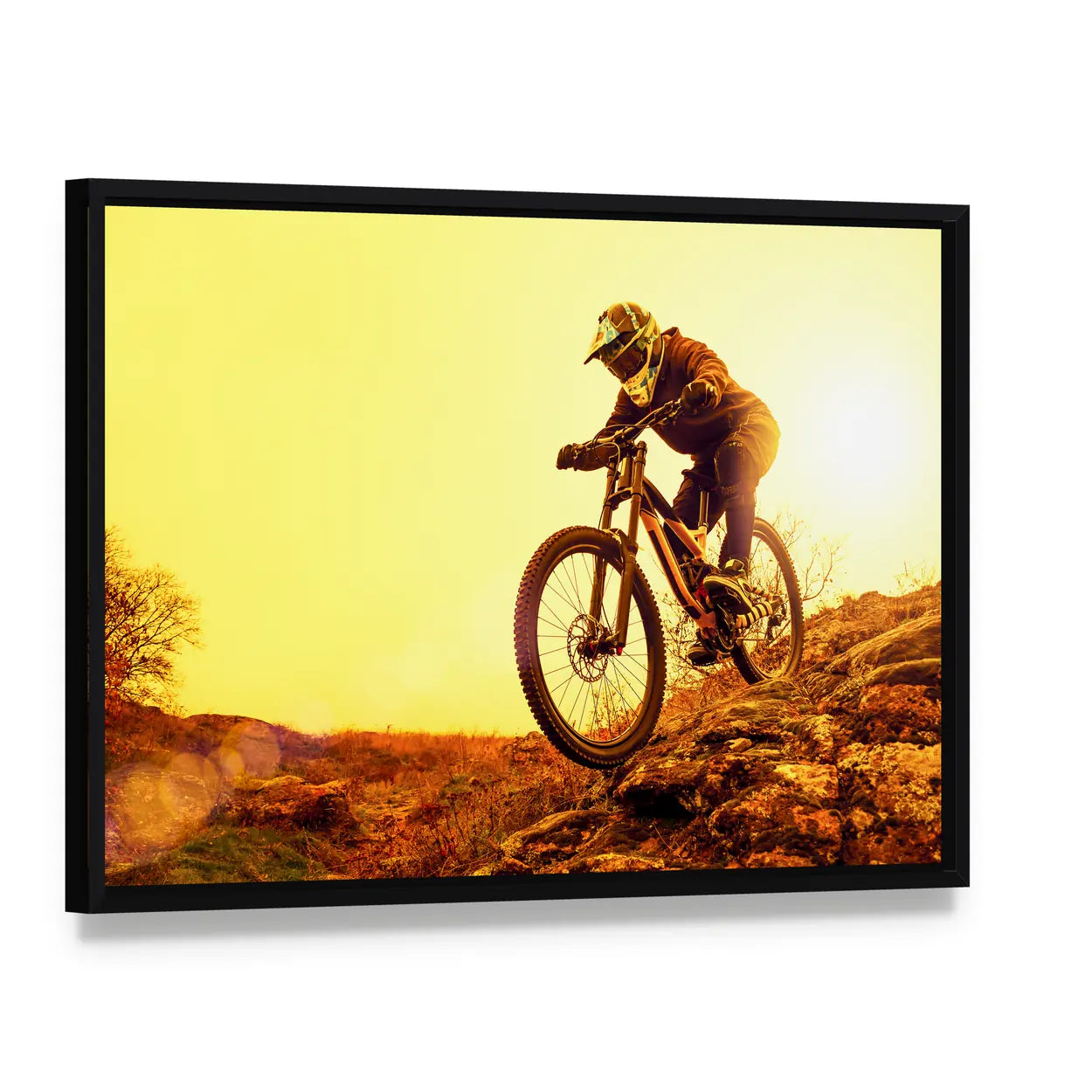 Cyclist Riding Mountain Bike Canvas Wall Art, framed canvas in a black floater frame, angled product view