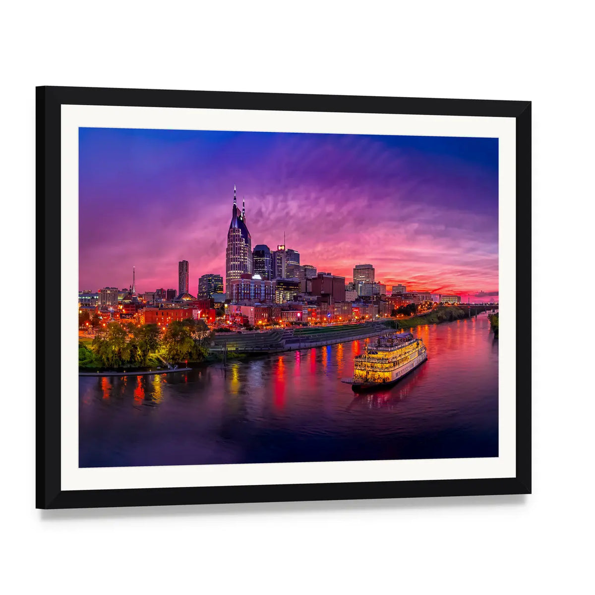 Nashville Skyline at Sunset with Paddlewheel Boat Canvas Wall Art, framed print with white mat and black frame, angled product view
