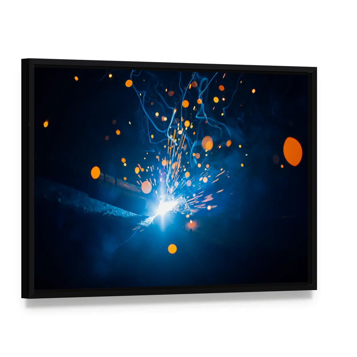 Welding Arc with Blue Smoke and Sparks Canvas Wall Art, framed canvas in a black floater frame, angled product view
