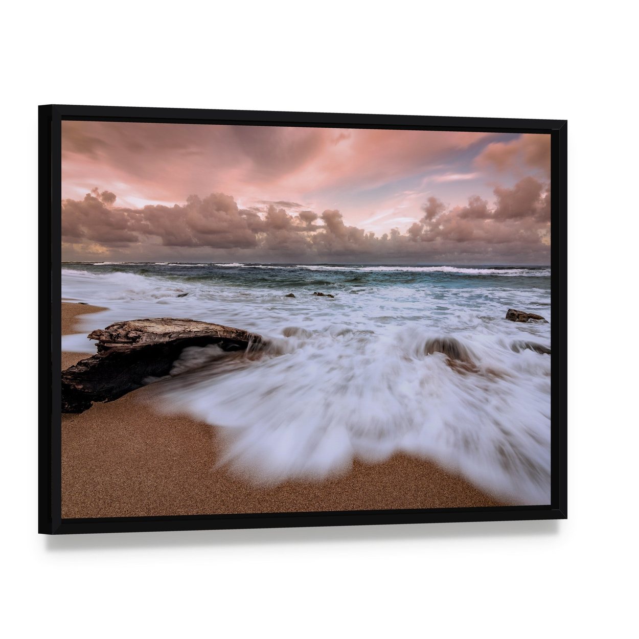 Driftwood on Beach with Long Exposure Waves Canvas Wall Art, framed canvas in a black floater frame, angled product view
