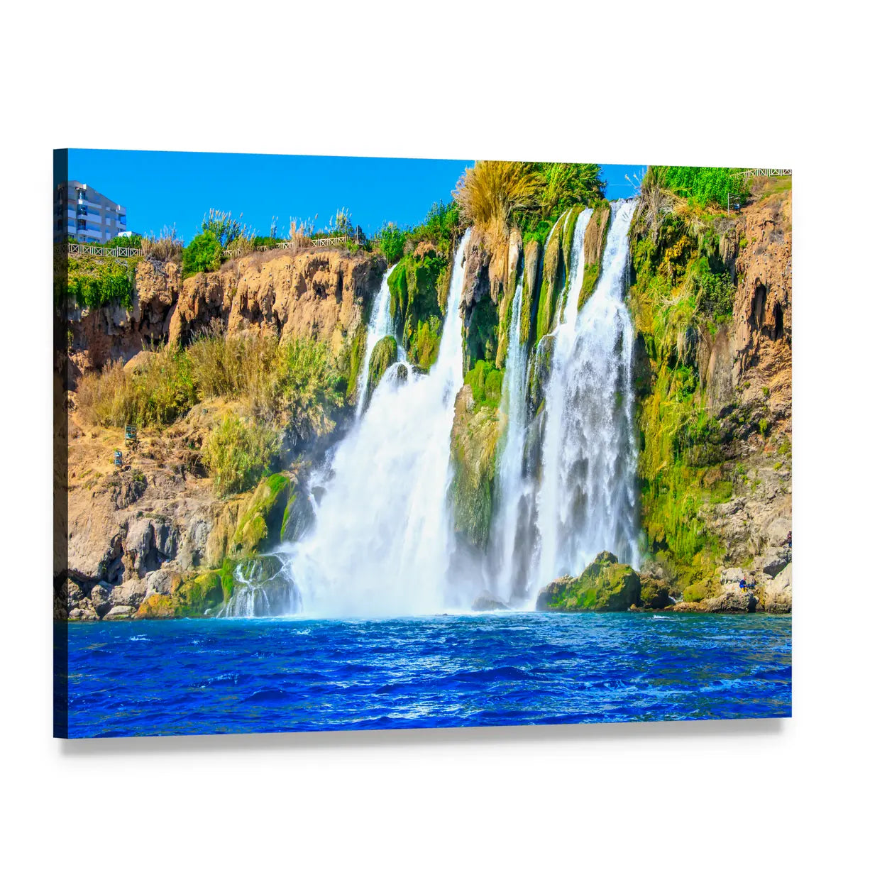 Moss-covered Cliff Waterfall Over Deep Blue Pool Canvas Wall Art, single panel gallery wrapped canvas, angled product view