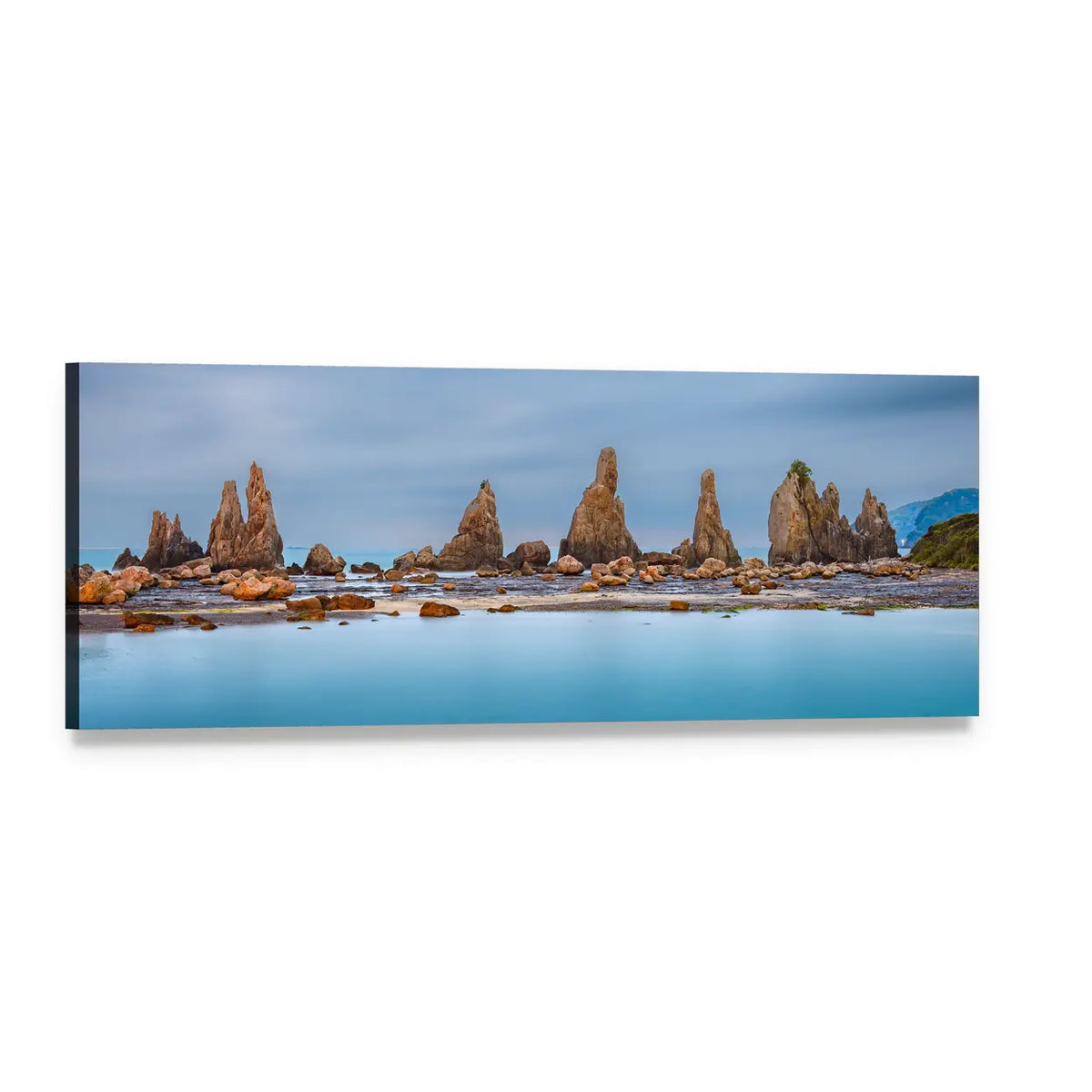 Jagged Sea Stacks on Calm Blue Coast Panoramic Canvas Wall Art, single panel gallery wrapped canvas, angled product view