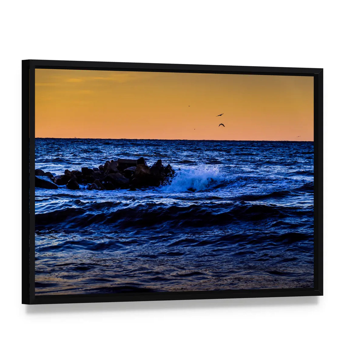Blue Ocean Waves at Sunset Canvas Wall Art, framed canvas in a black floater frame, angled product view