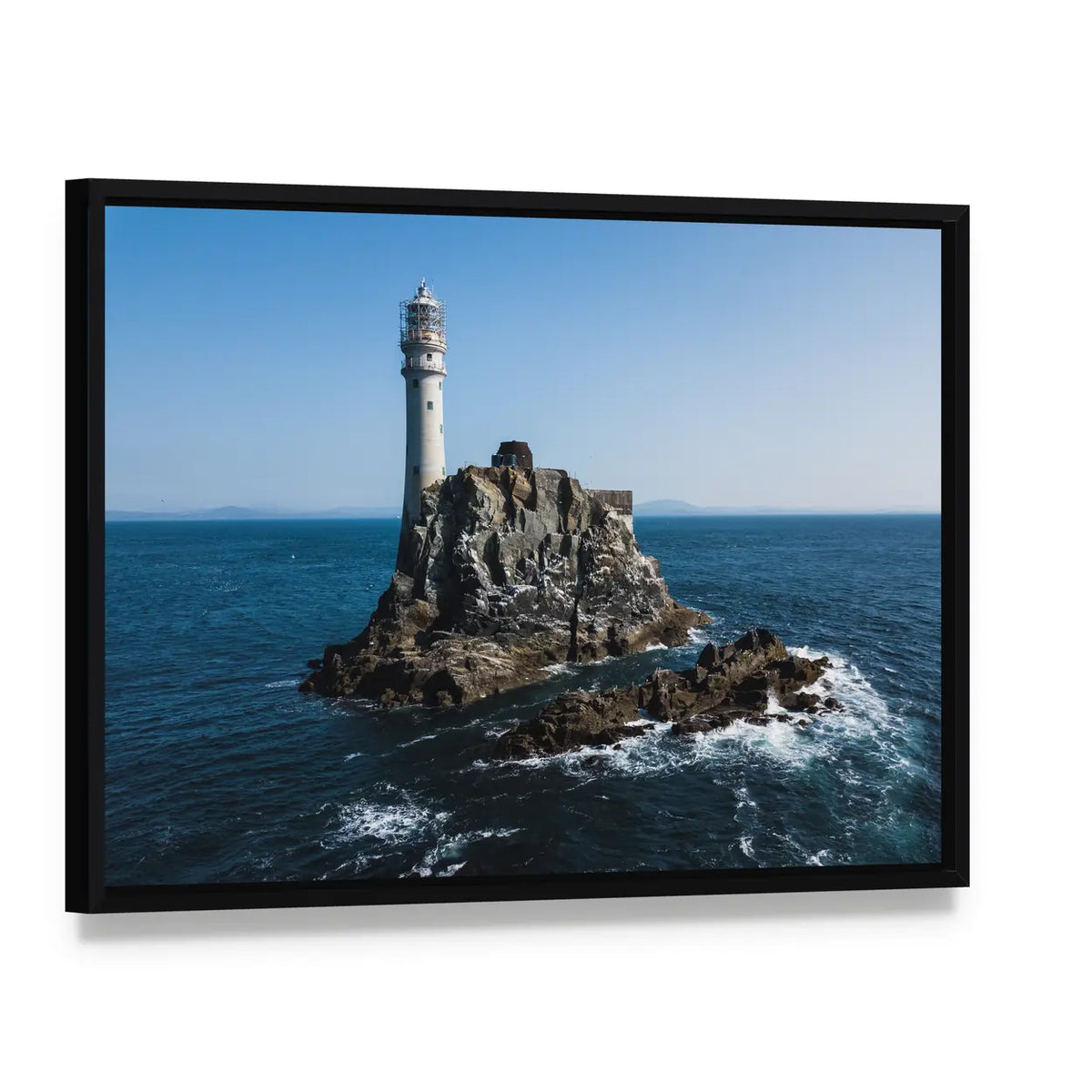 Fastnet Lighthouse Canvas Wall Art, framed canvas in a black floater frame, angled product view