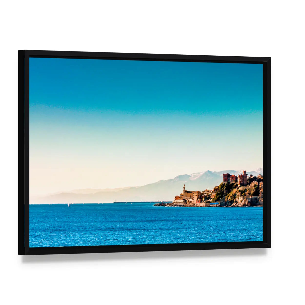 Genoa Coastal Village with Blue Sea Canvas Wall Art, framed canvas in a black floater frame, angled product view