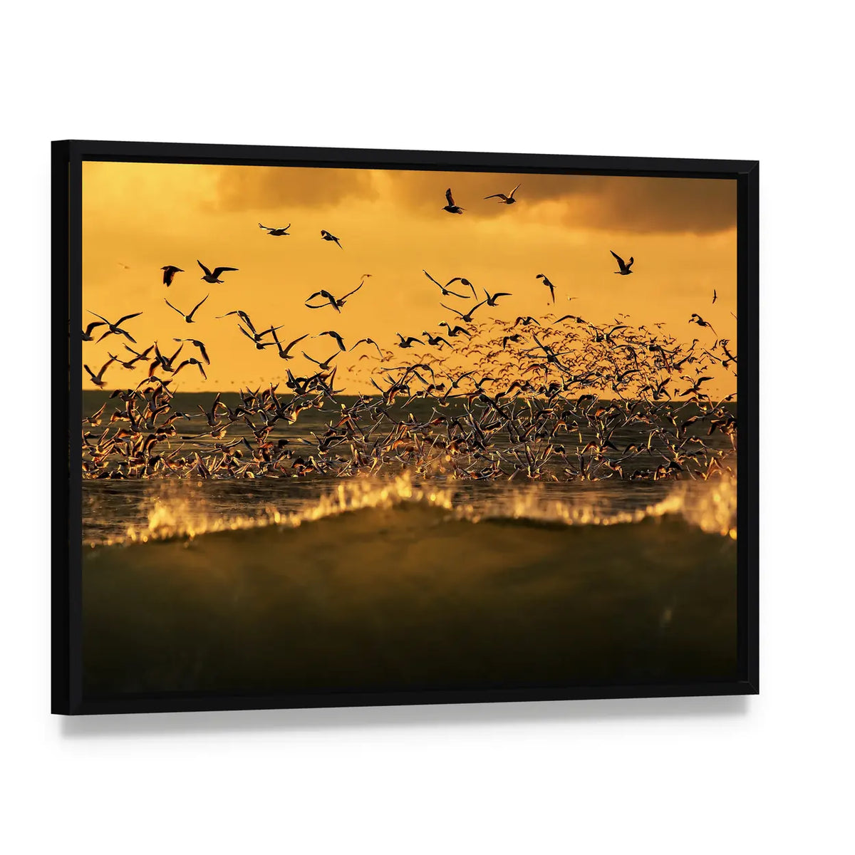 Seagulls Hovering Over Stormy Sea Canvas Wall Art, framed canvas in a black floater frame, angled product view