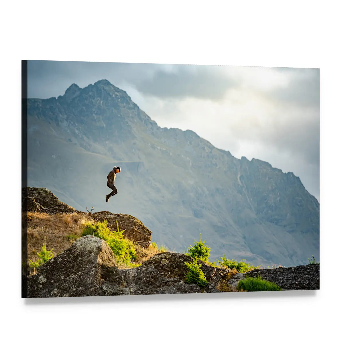 Young Man Jumping on Queenstown Hill Canvas Wall Art, single panel gallery wrapped canvas, angled product view