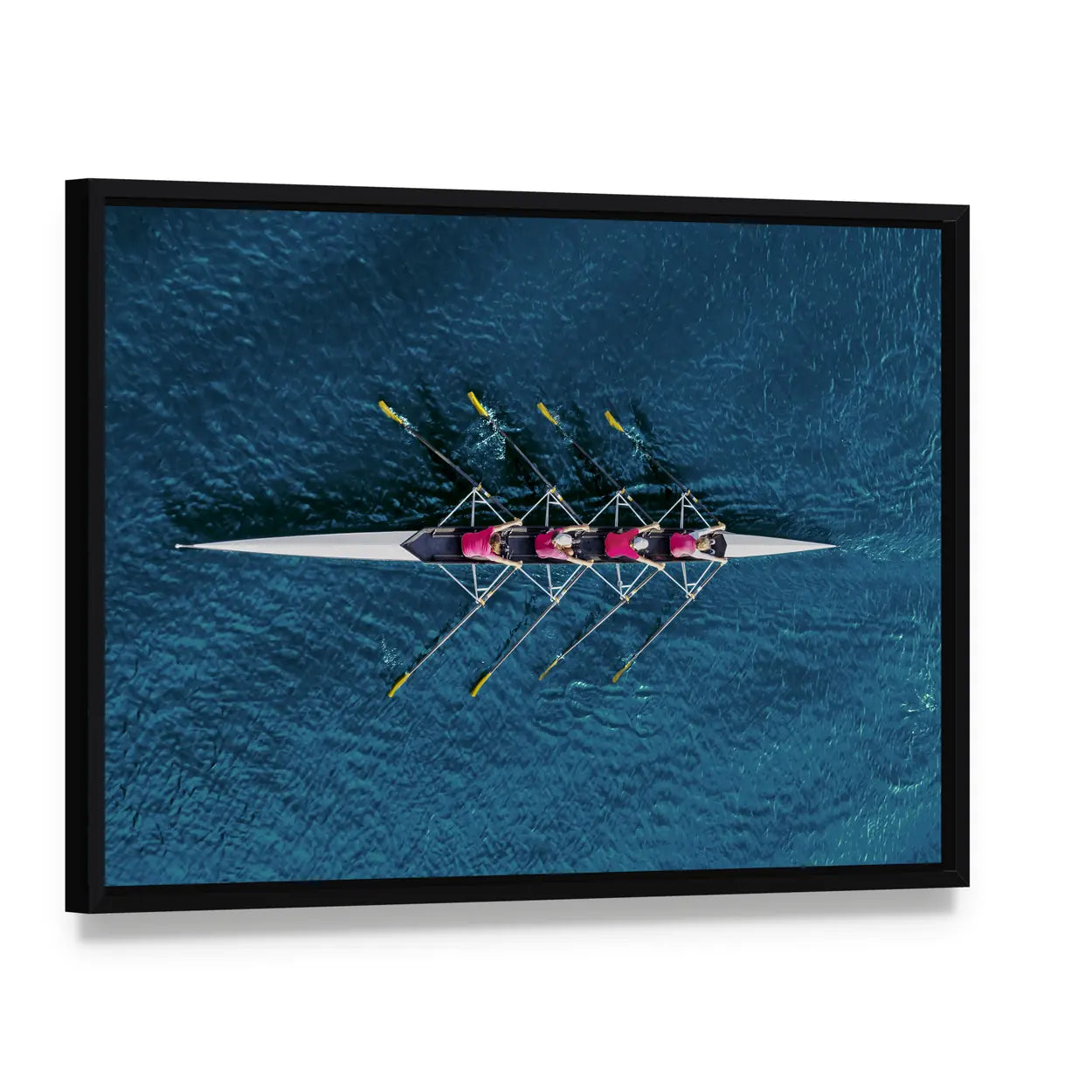 Women's Rowing Team on Blue Water Canvas Wall Art, framed canvas in a black floater frame, angled product view