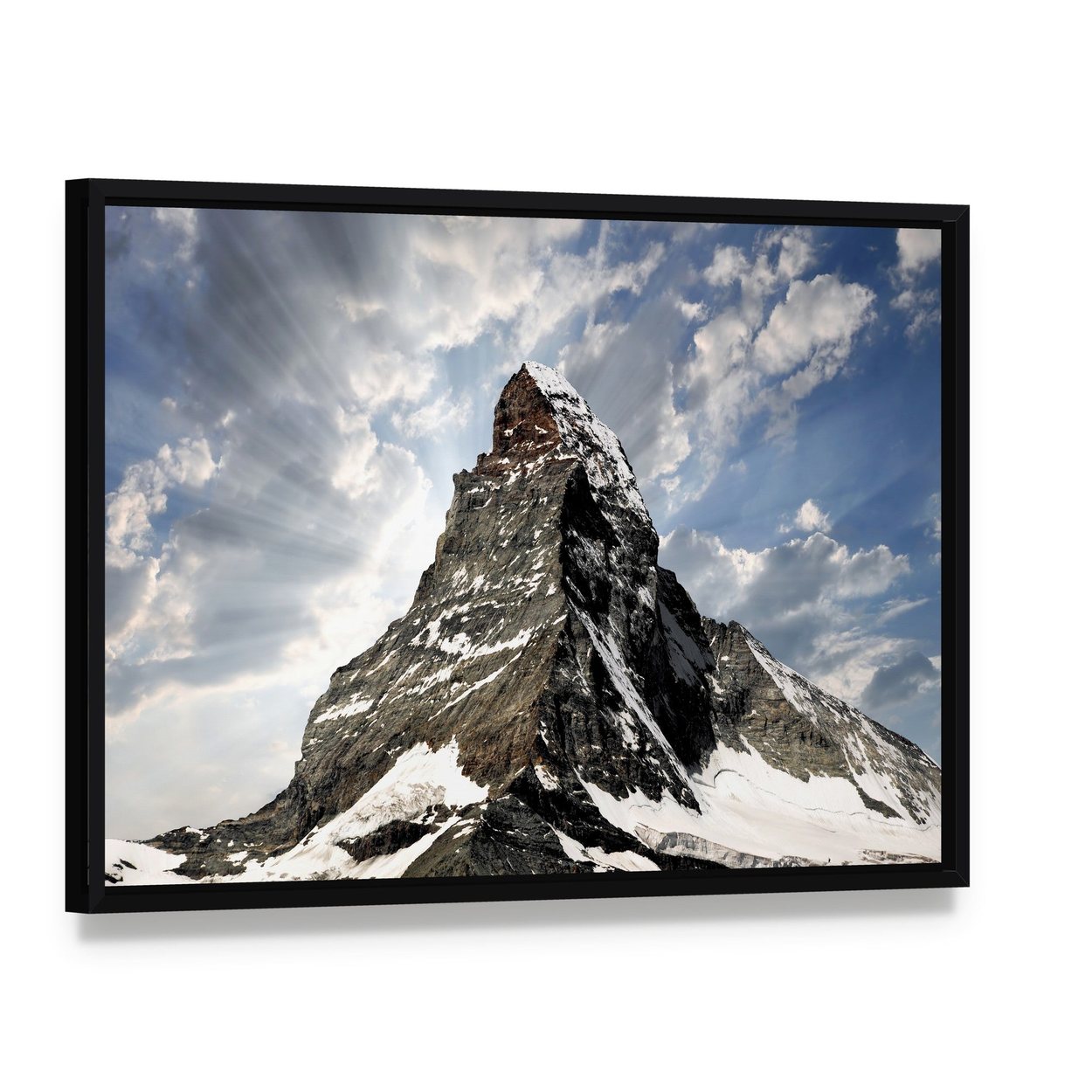 Matterhorn with Sun Rays Breaking Through Clouds Canvas Wall Art, framed canvas in a black floater frame, angled product view