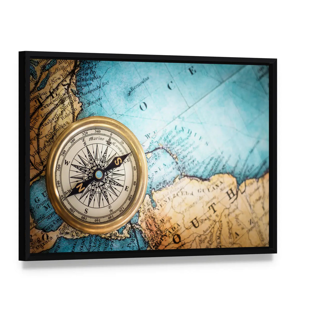 Brass Compass on Antique World Map Canvas Wall Art, framed canvas in a black floater frame, angled product view