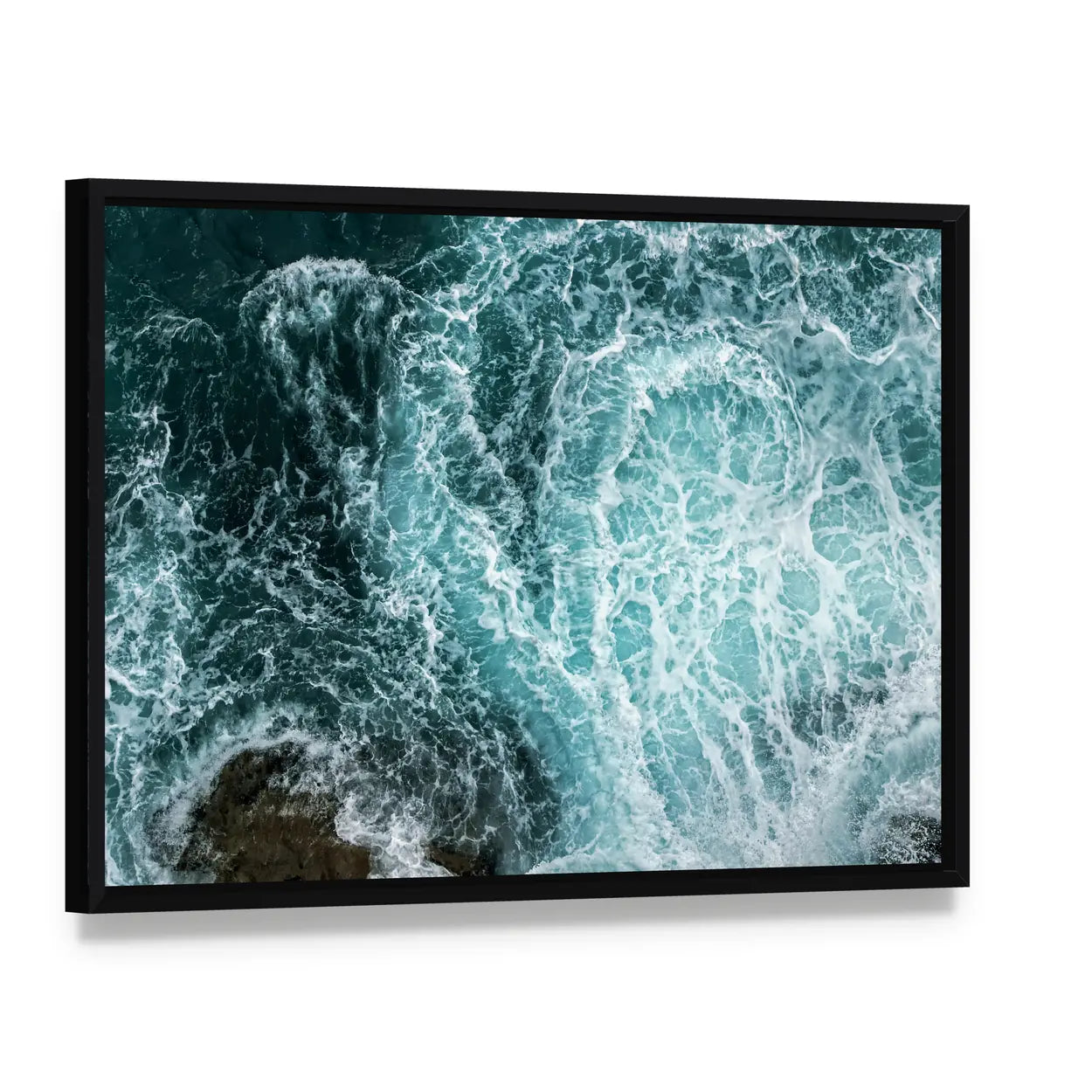 Waves In Blue Ocean Canvas Wall Art, framed canvas in a black floater frame, angled product view