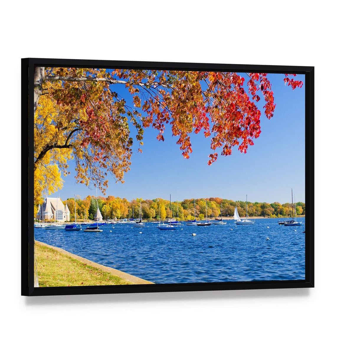 Autumn Lakeshore with Sailboats Canvas Wall Art, framed canvas in a black floater frame, angled product view