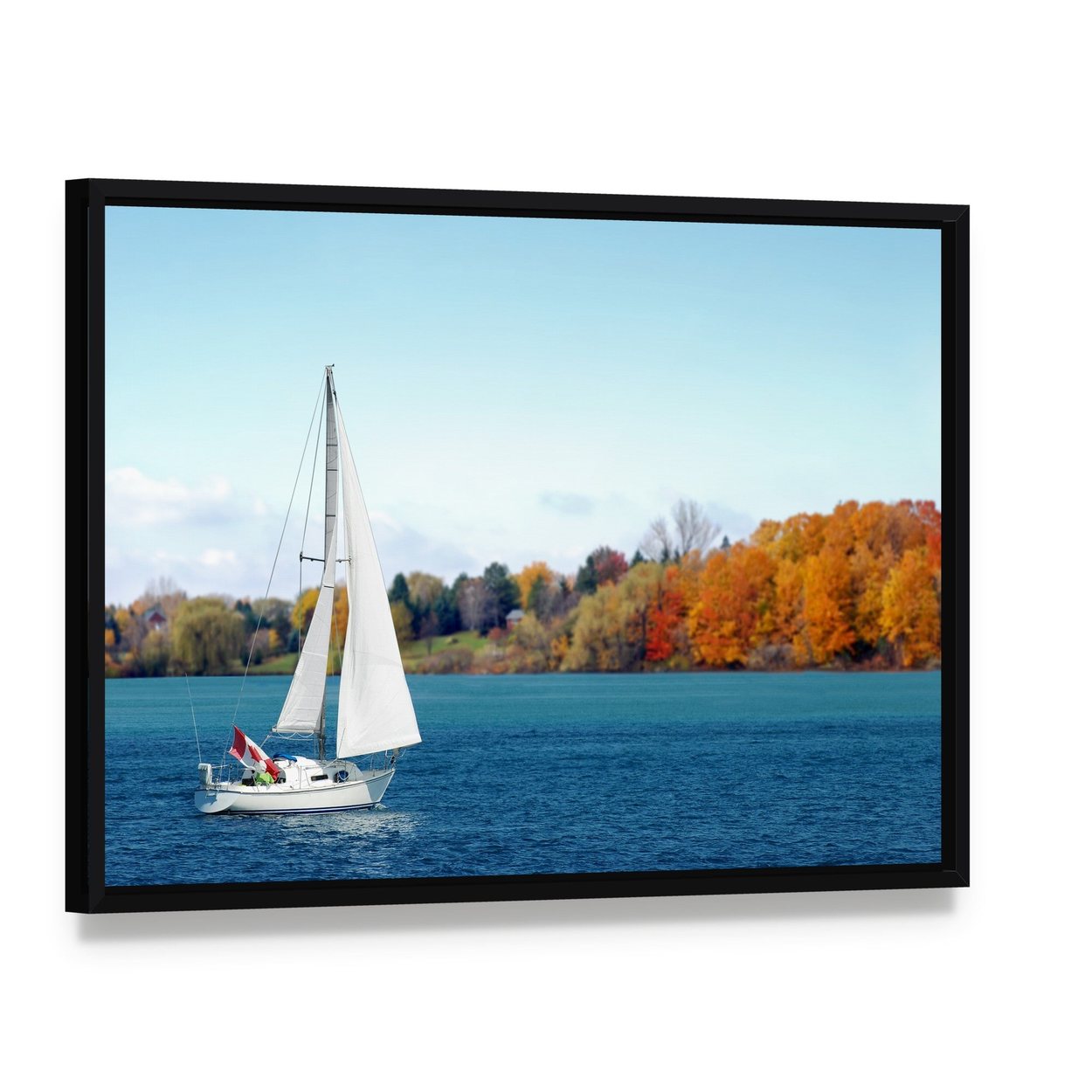 Canadian Sailboat on Lake Canvas Wall Art, framed canvas in a black floater frame, angled product view