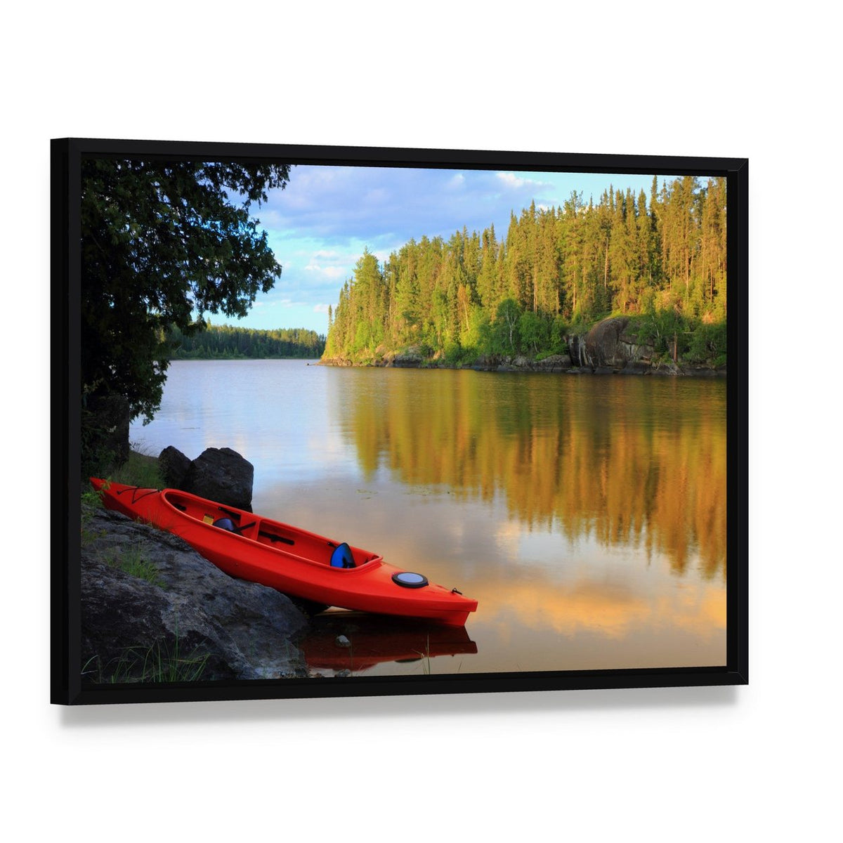 Red Canoe on Rocky Lakeshore at Sunset Canvas Wall Art, framed canvas in a black floater frame, angled product view