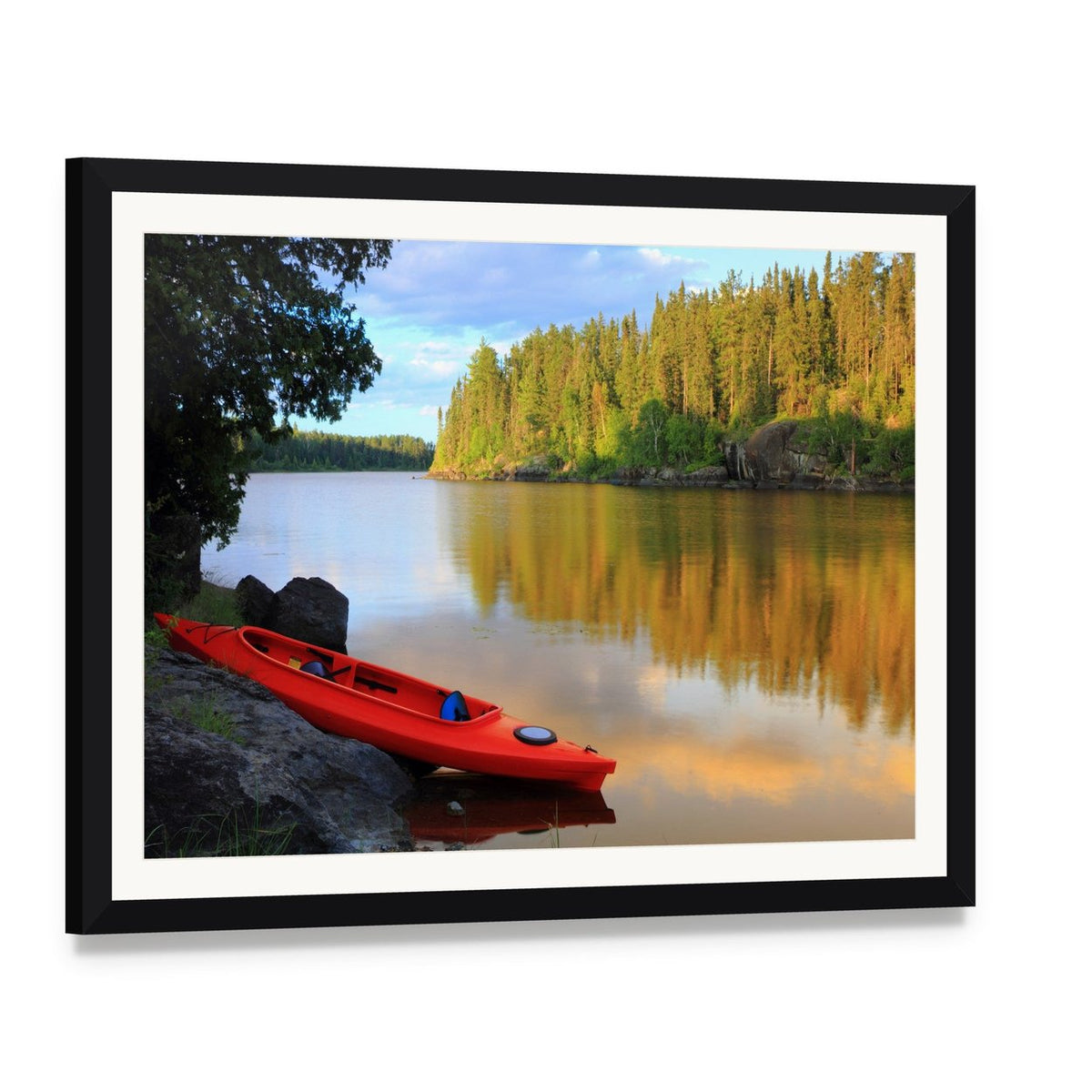 Red Canoe on Rocky Lakeshore at Sunset Canvas Wall Art, framed print with white mat and black frame, angled product view