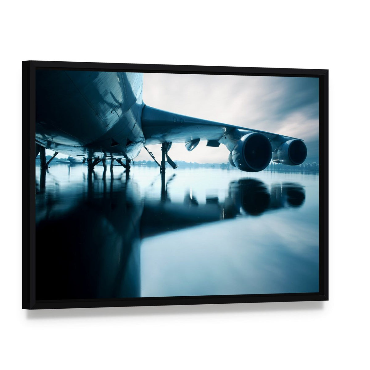 Airplane Over Water Canvas Wall Art, framed canvas in a black floater frame, angled product view