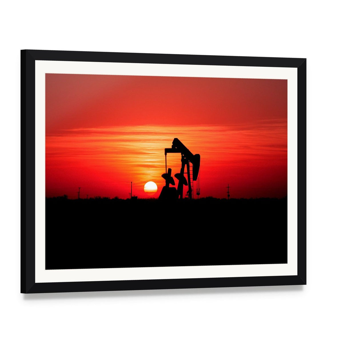 Silhouetted Oil Pump Jack at Sunset Canvas Wall Art, framed print with white mat and black frame, angled product view