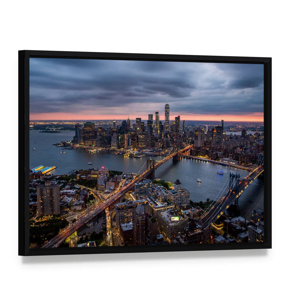 New York City at Night Canvas Wall Art, framed canvas in a black floater frame, angled product view