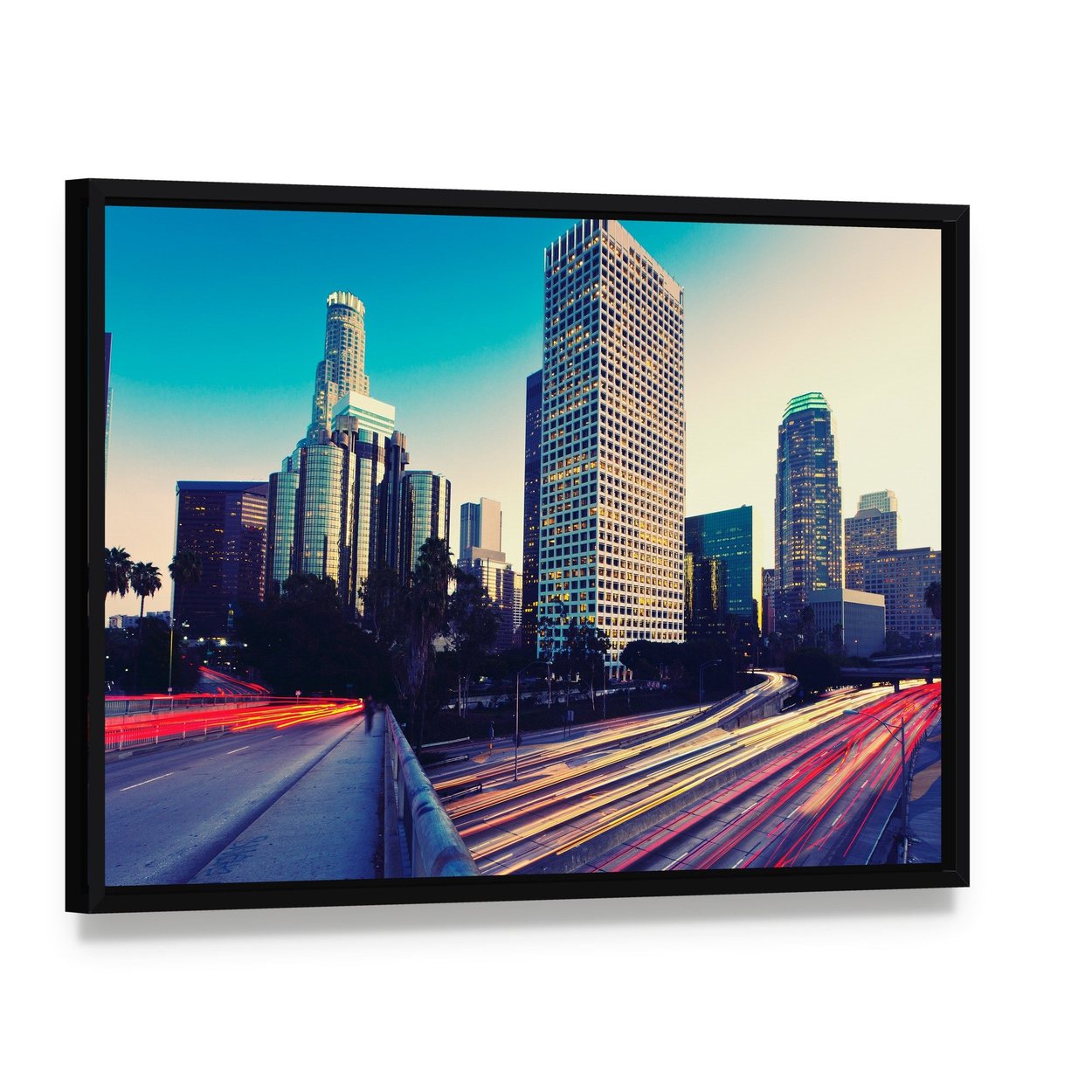 Urban City at Sunset Canvas Wall Art, framed canvas in a black floater frame, angled product view