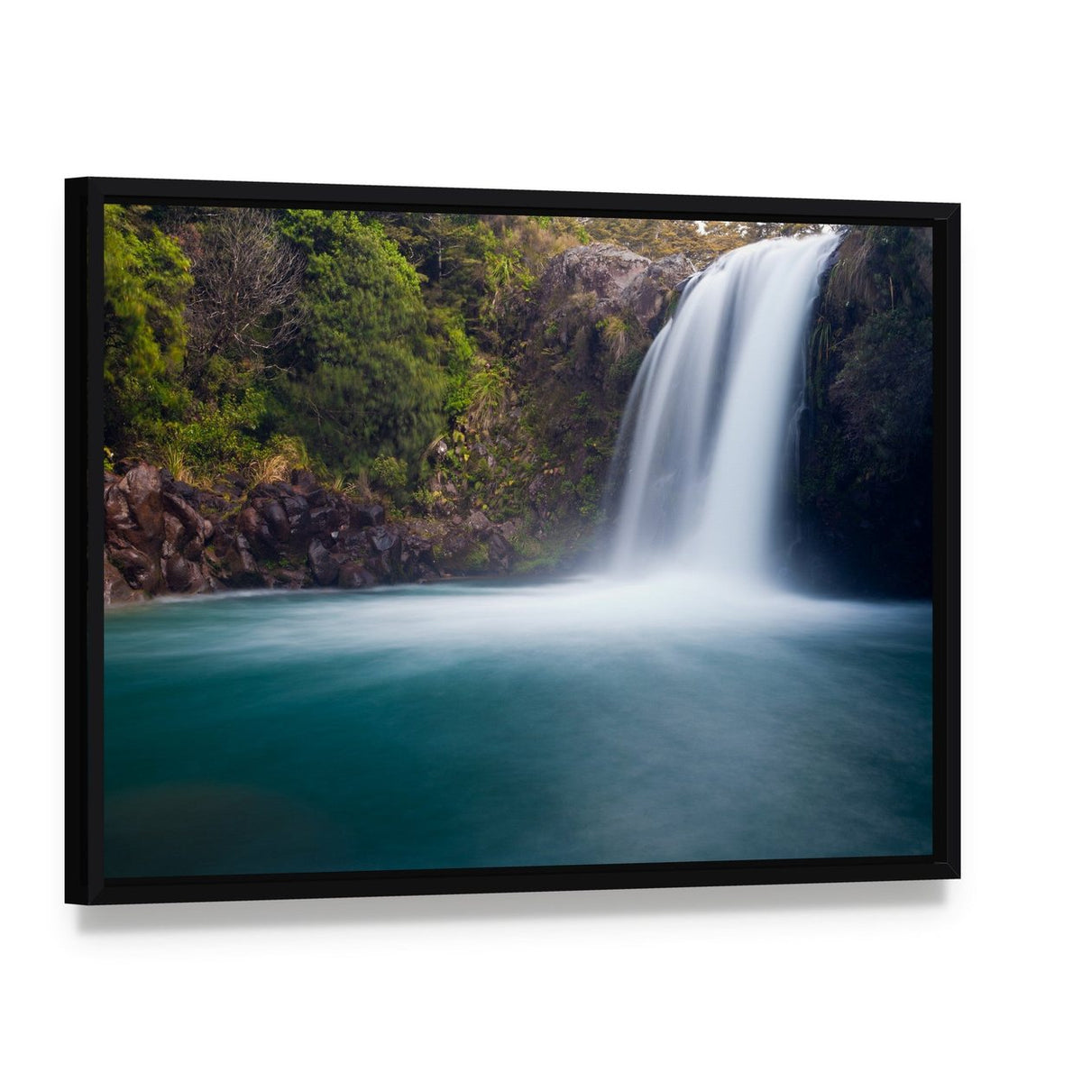 Tawhai Waterfall New Zealand Canvas Wall Art, framed canvas in a black floater frame, angled product view